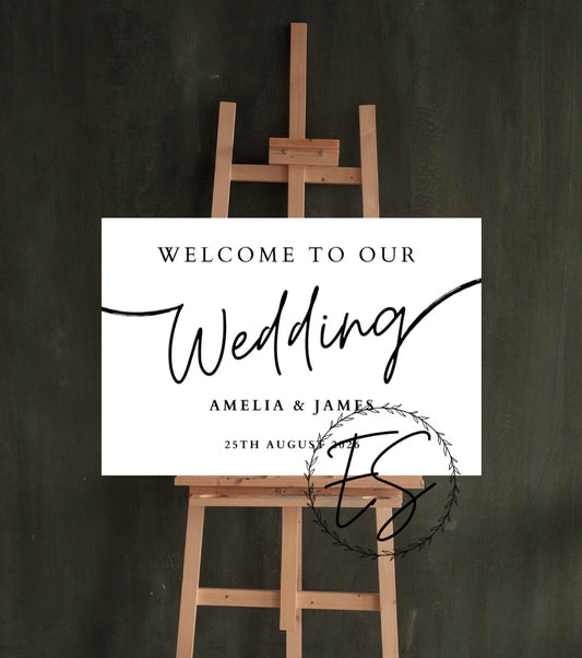 White Welcome wedding sign with black writing